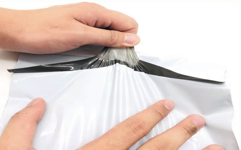 Máquina para fabricar bolsas compostables de PE Express de doble canal con cinta adhesiva